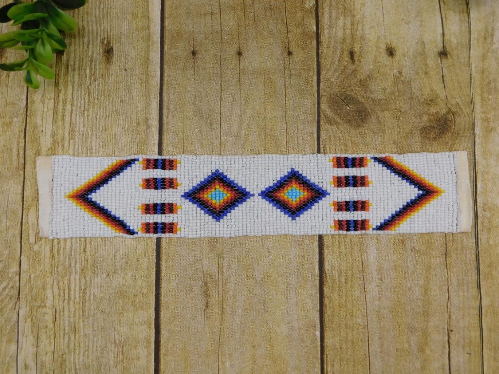 SEED BEAD NATIVE AMERICAN DESIGN BAND: SEED BEAD NATIVE AMERICAN DESIGN BAND — Part of our Discover Hidden Harbor, Crystals and Gems auction at HATMAN'S Auctions! Please see photos for measurements and condition. YES, we have in-house sh