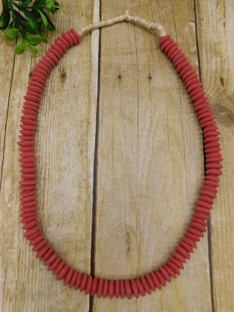 RED DISC AFRICAN TRADE BEAD NECKLACE: RED DISC AFRICAN TRADE BEAD NECKLACE — Part of our Discover Hidden Harbor, Crystals and Gems auction at HATMAN'S Auctions! Please see photos for measurements and condition. YES, we have in-house