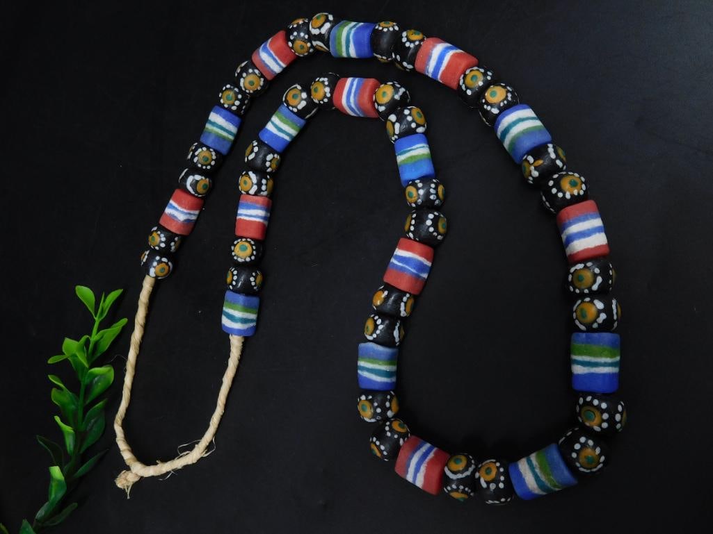 HAND PAINTED MULTICOLORED AFRICAN TRADE BEAD NECKLACE: HAND PAINTED MULTICOLORED AFRICAN TRADE BEAD NECKLACE — Part of our Discover Hidden Harbor, Crystals and Gems auction at HATMAN'S Auctions! Please see photos for measurements and condition. YES, we 