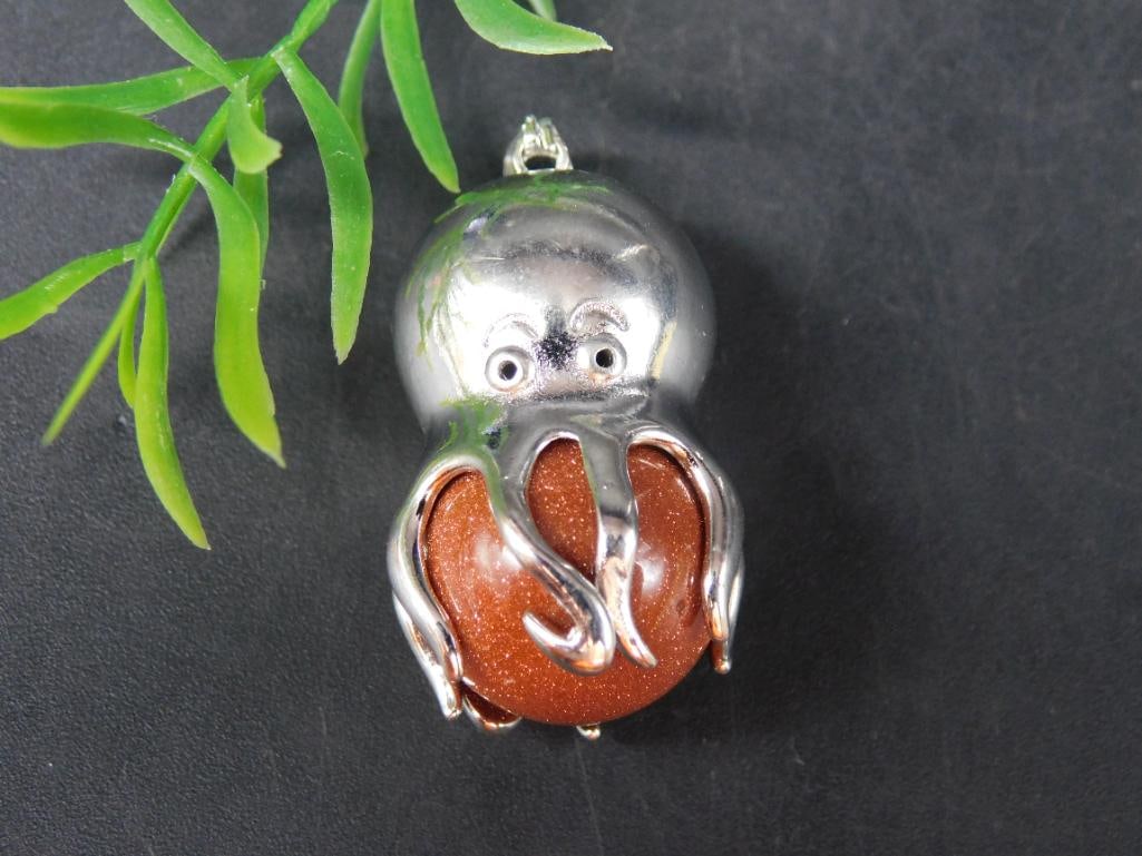 OCTOPUS PENDANT ROCK STONE LAPIDARY SPECIMEN: OCTOPUS PENDANT ROCK STONE LAPIDARY SPECIMEN - Part of our Discover Golden Attic, Crystals and Gems auction at HATMAN'S Auctions! Please see photos for measurements and condition. YES, we have