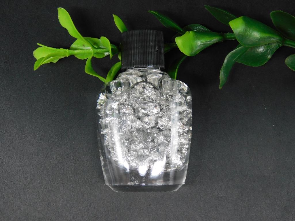 SILVER FLAKES IN BOTTLE ROCK STONE LAPIDARY SPECIMEN: SILVER FLAKES IN BOTTLE ROCK STONE LAPIDARY SPECIMEN - Part of our Discover Golden Attic, Crystals and Gems auction at HATMAN'S Auctions! Please see photos for measurements and condition. YES, we