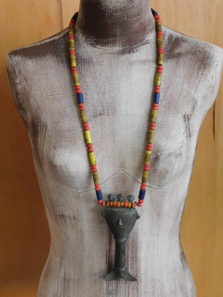 NAGA PENDANT ON AFRICAN TRADE BEAD NECKLACE: NAGA PENDANT ON AFRICAN TRADE BEAD NECKLACE - Part of our Discover Golden Attic, Crystals and Gems auction at HATMAN'S Auctions! Please see photos for measurements and condition. YES, we have
