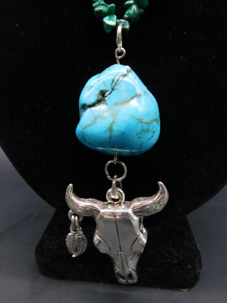 COW SKULL AND TURQUOISE PENDANT ON MALACHITE CHIP NECKLACE: COW SKULL AND TURQUOISE PENDANT ON MALACHITE CHIP NECKLACE - Part of our Discover Midnight Market, Crystals and Gems auction at HATMAN'S Auctions! Please see photos for measurements and condition.