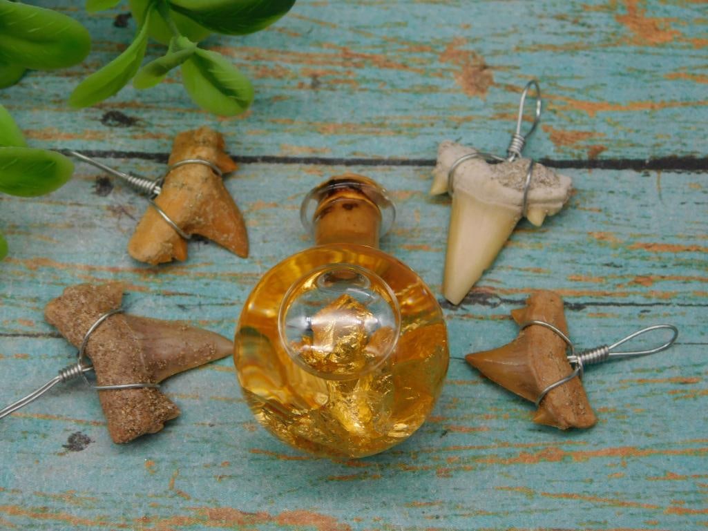 SHARK TEETH PENDANTS AND GOLD FLAKES IN BOTTLE: SHARK TEETH PENDANTS AND GOLD FLAKES IN BOTTLE