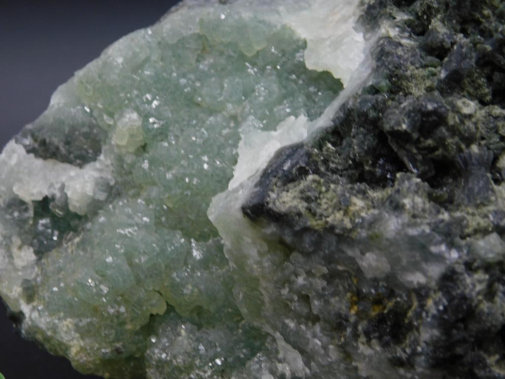 Phrenite Specimen Featuring Green Crystals and Black Matrix - 2