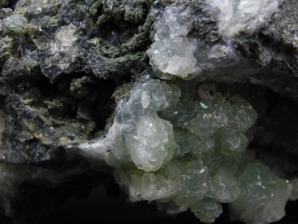 Phrenite Specimen Featuring Green Crystals and Black Matrix - 3