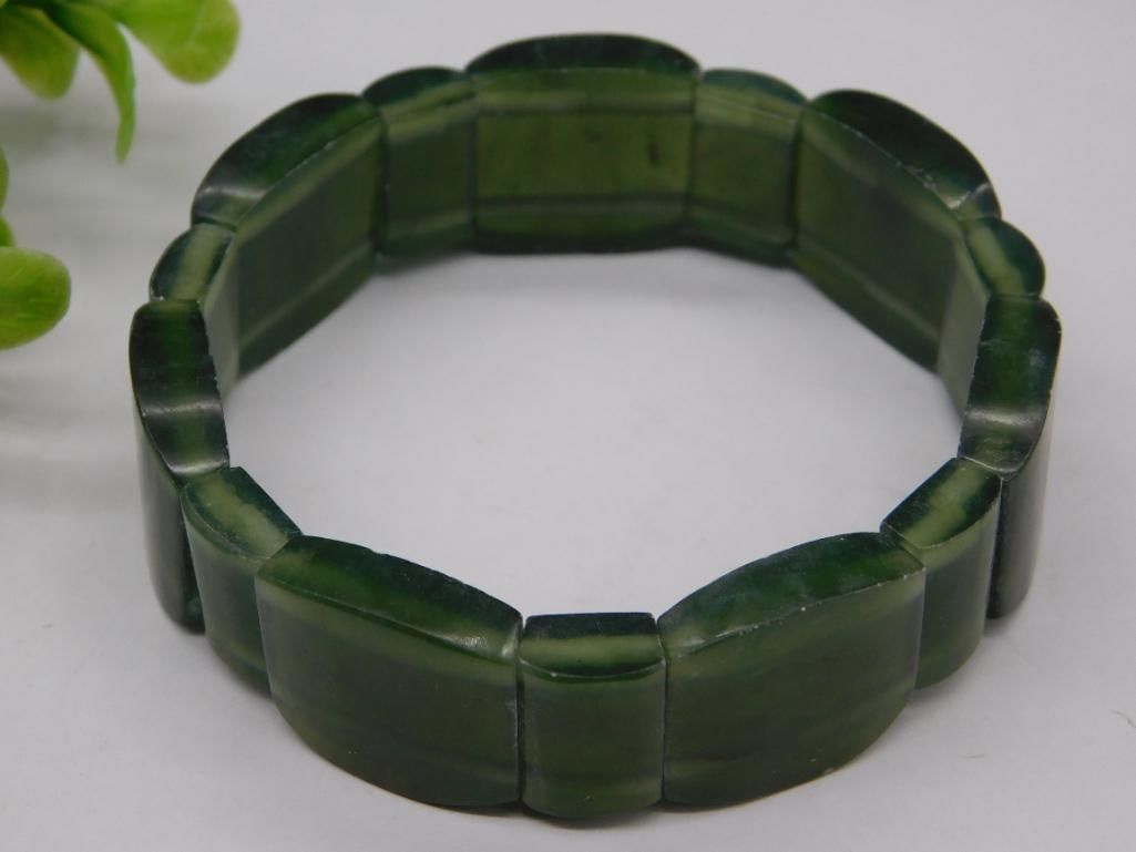 GREEN JADE STRETCH BRACELET ROCK STONE LAPIDARY SPECIMEN: GREEN JADE STRETCH BRACELET ROCK STONE LAPIDARY SPECIMEN — Part of our Discover Vintage Vault, Crystals and Gems auction at HATMAN'S Auctions! Please see photos for measurements and condition. YES,
