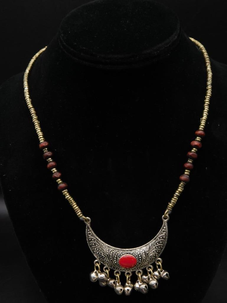 RED JASPER CRESCENT MOON NECKLACE WITH BELLS ROCK STONE LAPIDARY SPECIMEN: RED JASPER CRESCENT MOON NECKLACE WITH BELLS ROCK STONE LAPIDARY SPECIMEN — Part of our Discover Vintage Vault, Crystals and Gems auction at HATMAN'S Auctions! Please see photos for measurements