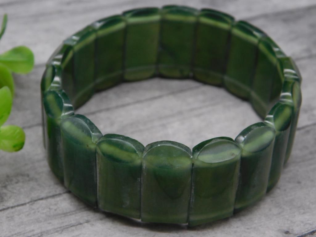 GREEN JADE STRETCH BRACELET ROCK STONE LAPIDARY SPECIMEN: GREEN JADE STRETCH BRACELET ROCK STONE LAPIDARY SPECIMEN — Part of our Discover Vintage Vault, Crystals and Gems auction at HATMAN'S Auctions! Please see photos for measurements and condition. YES,