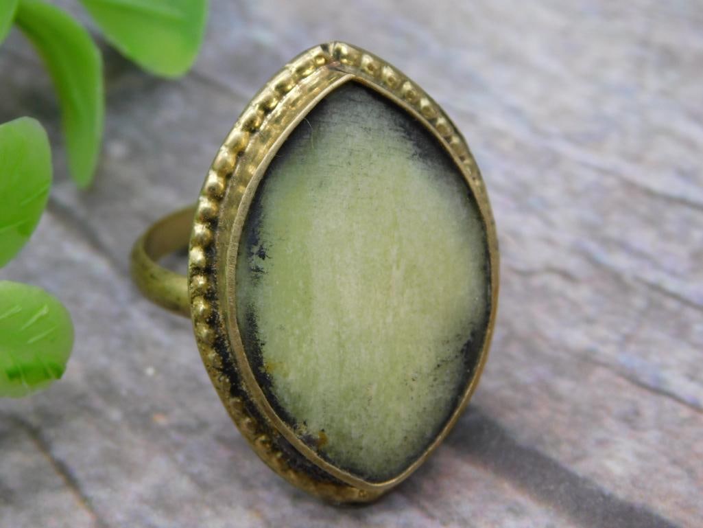 PREHNITE RING SIZE 8.5 ROCK STONE LAPIDARY SPECIMEN: PREHNITE RING SIZE 8.5 ROCK STONE LAPIDARY SPECIMEN — Part of our Discover Vintage Vault, Crystals and Gems auction at HATMAN'S Auctions! Please see photos for measurements and condition. YES, we