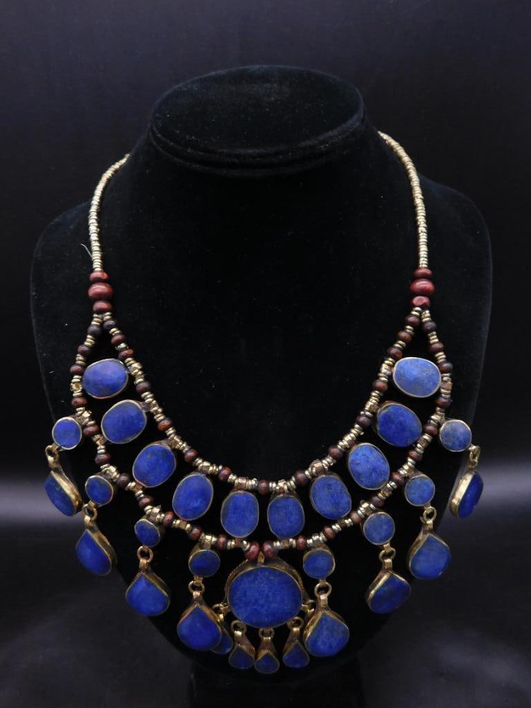 LAPIS LAZULI BIB STYLE NECKLACE ROCK STONE LAPIDARY SPECIMEN: LAPIS LAZULI BIB STYLE NECKLACE ROCK STONE LAPIDARY SPECIMEN — Part of our Discover Vintage Vault, Crystals and Gems auction at HATMAN'S Auctions! Please see photos for measurements and condition.