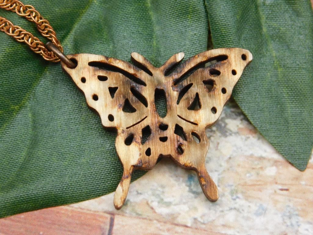 CARVED WOODEN BUTTERFLY PENDANT NECKLACE: CARVED WOODEN BUTTERFLY PENDANT NECKLACE - Authentic estate find offered in our online auction. Perfect for collectors, resellers, and enthusiasts of vintage, antiques, minerals, rocks, crystals,