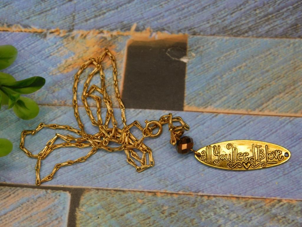 ALL YOU NEED IS LOVE NECKLACE: ALL YOU NEED IS LOVE NECKLACE - Authentic estate find offered in our online auction. Perfect for collectors, resellers, and enthusiasts of vintage, antiques, minerals, rocks, crystals, jewelry, and ra