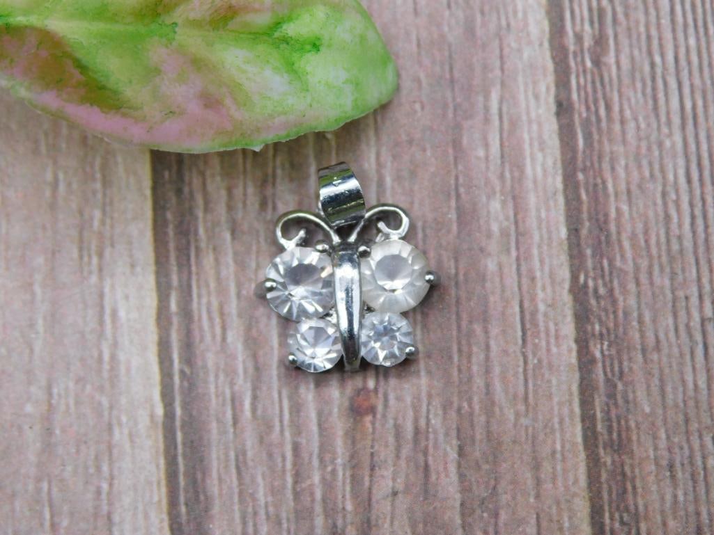 Small Butterfly Pendant With Clear Stones: Small Butterfly Pendant With Clear Stones - Part of our Discover Gilded Gallery, Crystals and Gems auction at HATMAN'S Auctions! Please see photos for measurements and condition. YES, we have