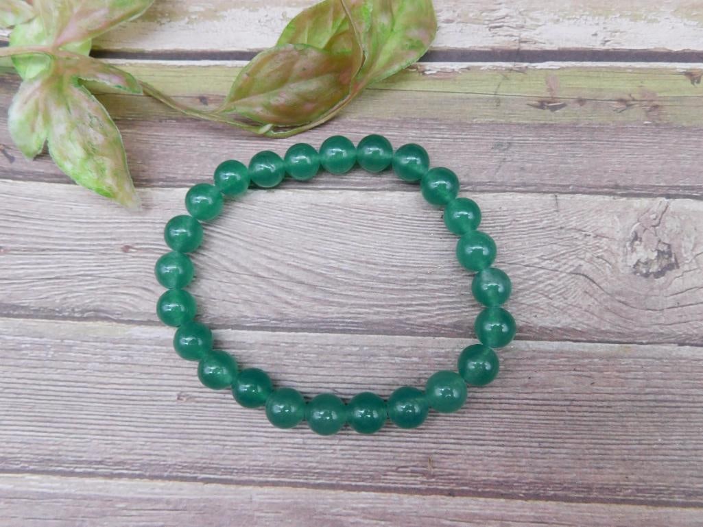Green Beaded Stretch Bracelet: Green Beaded Stretch Bracelet - Part of our Discover Gilded Gallery, Crystals and Gems auction at HATMAN'S Auctions! Please see photos for measurements and condition. YES, we have in-house shipping!