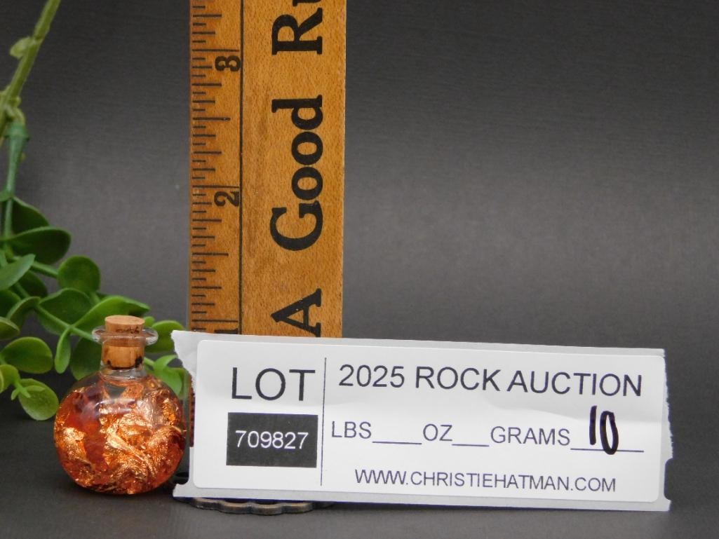 Glass Vial Containing Copper Flakes Rock Stone Lapidary Specimen: Glass Vial Containing Copper Flakes Rock Stone Lapidary Specimen - ? Small round glass vial filled with copper flakes. | ? Sealed with a cork stopper for secure containment. | ? Includes a ruler in