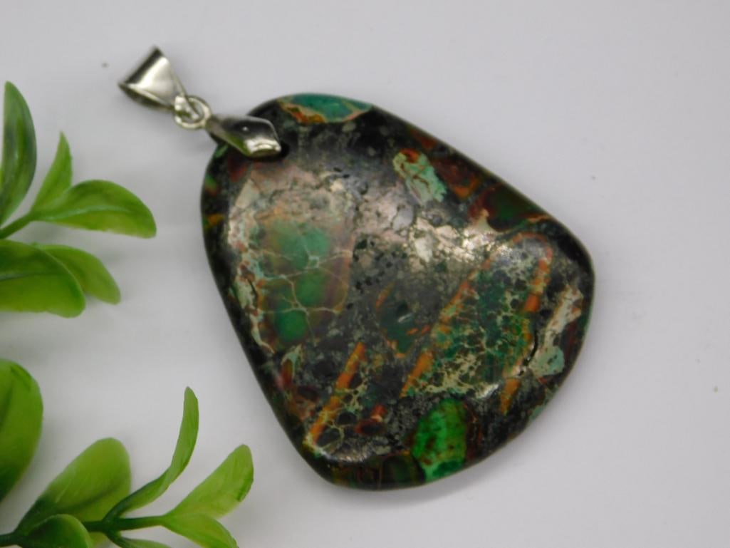 GENUINE STONE PENDANT ROCK STONE LAPIDARY SPECIMEN: GENUINE STONE PENDANT ROCK STONE LAPIDARY SPECIMEN - Part of our Discover Gilded Gallery, Crystals and Gems auction at HATMAN'S Auctions! Please see photos for measurements and condition. YES, we have