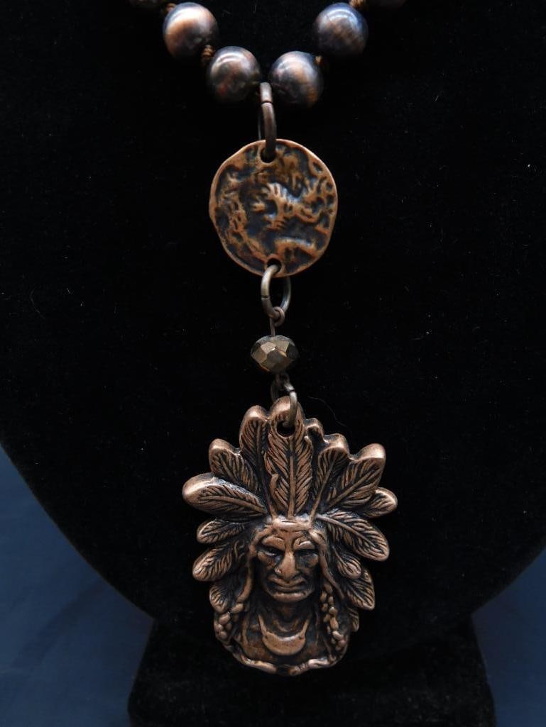 CHIEF PENDANT ON CHAIN NECKLACE: CHIEF PENDANT ON CHAIN NECKLACE - Part of our Discover Twilight Bazaar, Crystals and Gems auction at HATMAN'S Auctions! Please see photos for measurements and condition. YES, we have in-house