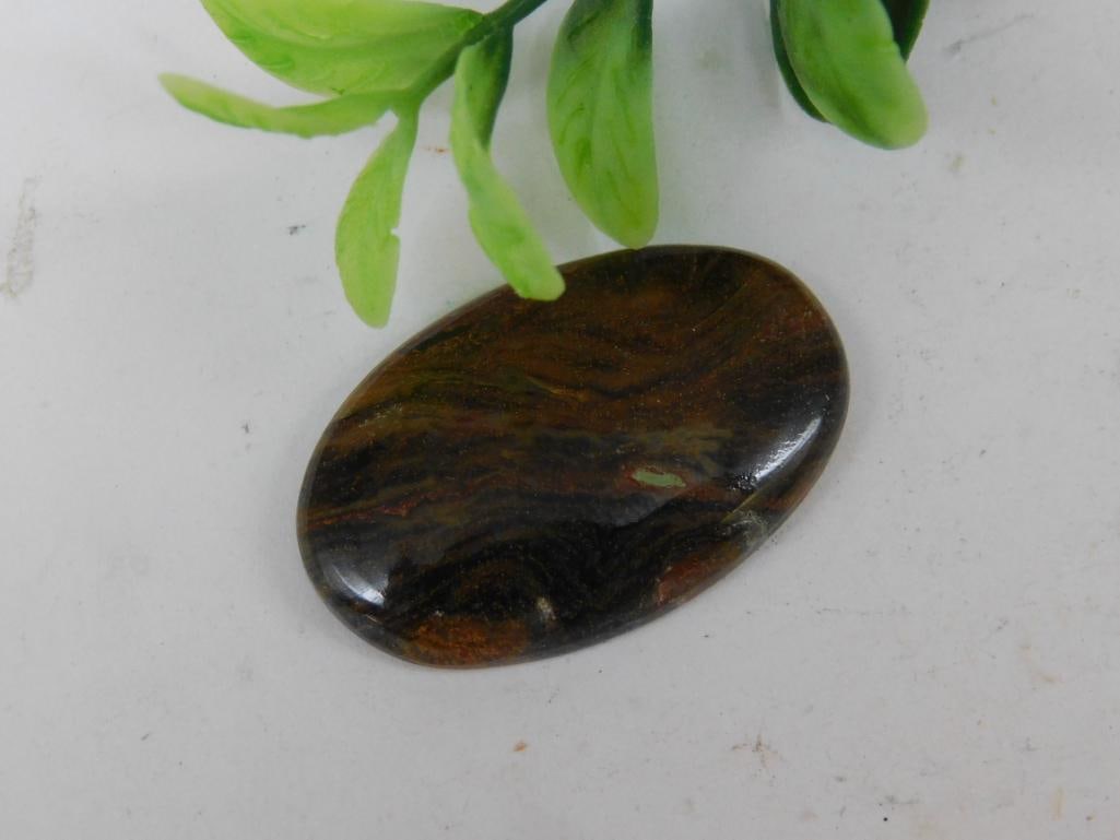 PIETERSITE CABOCHON ROCK STONE LAPIDARY SPECIMEN: WELCOME TO HATMAN AUCTIONS! SPECIAL NOTICE: Please see photos for measurements and descriptions. ***Yes, we have in house shipping with MANY REPEAT CUSTOMERS because of our streamlined service. ****We