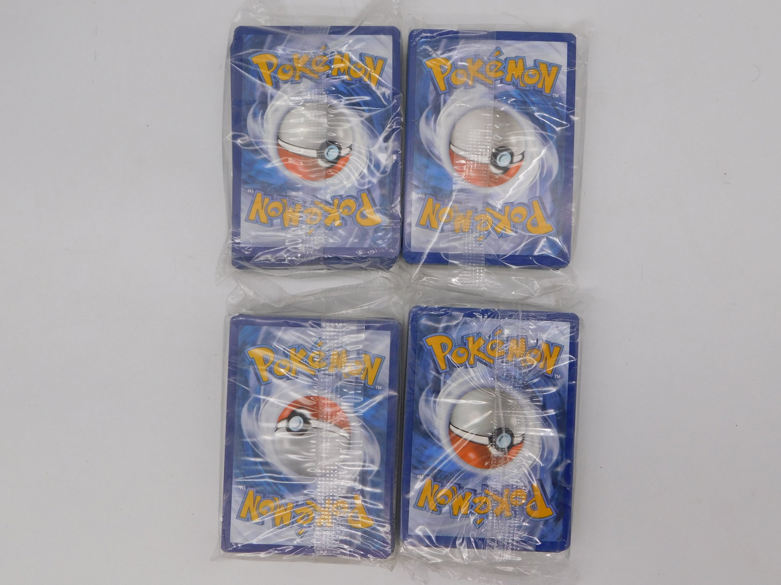 Pokemon Collectible Bundle Sealed Pokeballs Trading Card Game Energy Cards Lot: Pokemon Collectible Bundle Sealed Pokeballs Trading Card Game Energy Cards Lot features four sealed Pokemon Pokeball merchandise items in original blue packaging, displayed alongside four Pokemon Trad