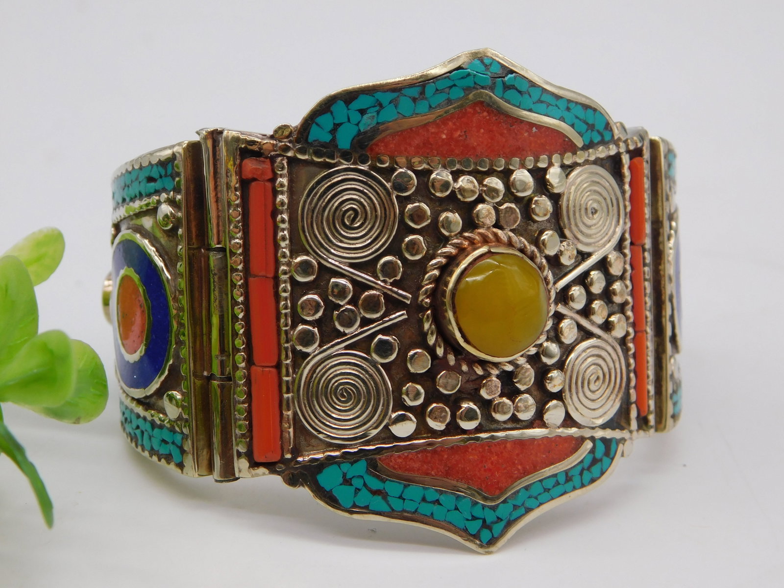 Turquoise Coral Lapis Lazuli Hinged Cuff Bracelet Brass Inlay Jewelry: Tibetan Turquoise Coral Lapis Lazuli Hinged Cuff Bracelet Brass Inlay Jewelry presents an exceptional example of traditional Himalayan metalwork and gemstone artistry. This ornate hinged cuff bracelet