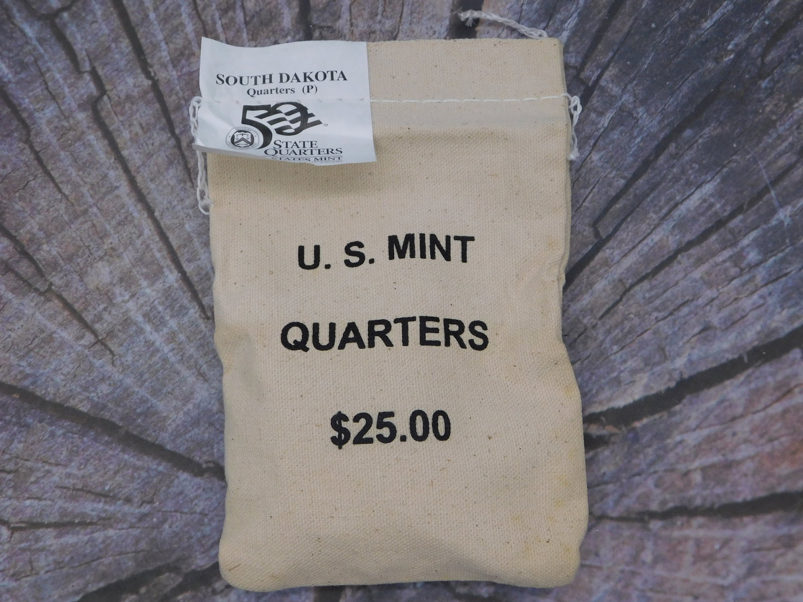 South Dakota State Quarters P Mint Mark U.S. Mint Sealed Bag Collectible Numismatic: South Dakota State Quarters P Mint Mark U.S. Mint Sealed Bag Collectible Numismatic represents an authentic factory-sealed U.S. Mint canvas bag containing twenty-five dollars face value of South
