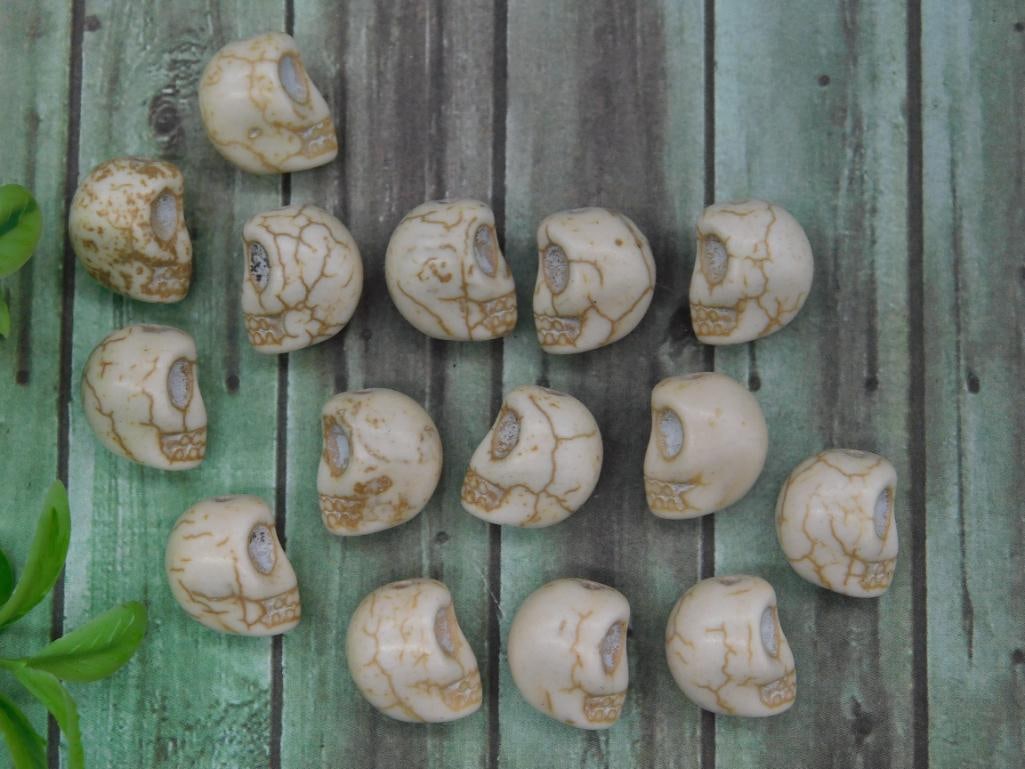 Set of 14 Carved Skull-Shaped Beads: Set of 14 Carved Skull-Shaped Beads