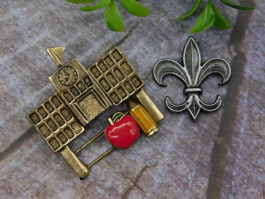 Two Decorative Pins School and Fleur-de-Lis: Two Decorative Pins School and Fleur-de-Lis — Part of our Discover Gilded Gallery, Crystals and Gems auction at HATMAN'S Auctions! Please see photos for measurements and condition. YES, we have