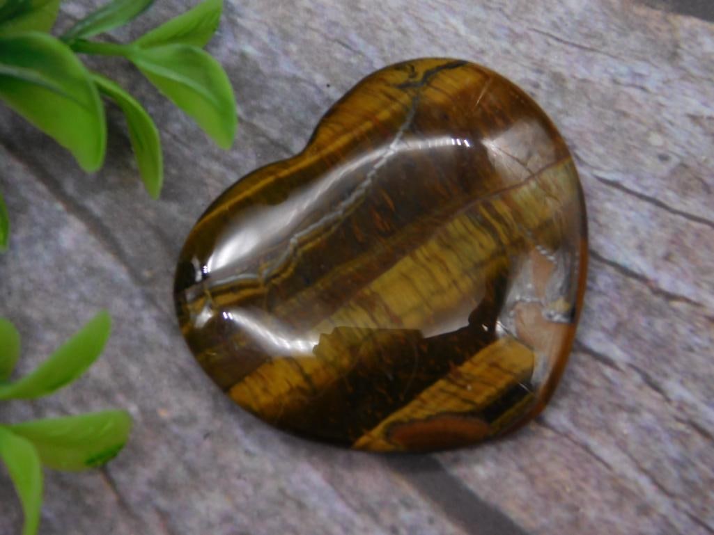 TIGER EYE HEART ROCK STONE LAPIDARY SPECIMEN: TIGER EYE HEART ROCK STONE LAPIDARY SPECIMEN — Part of our Discover Antique Alley, Crystals and Gems auction at HATMAN'S Auctions! Please see photos for measurements and condition. YES, we have