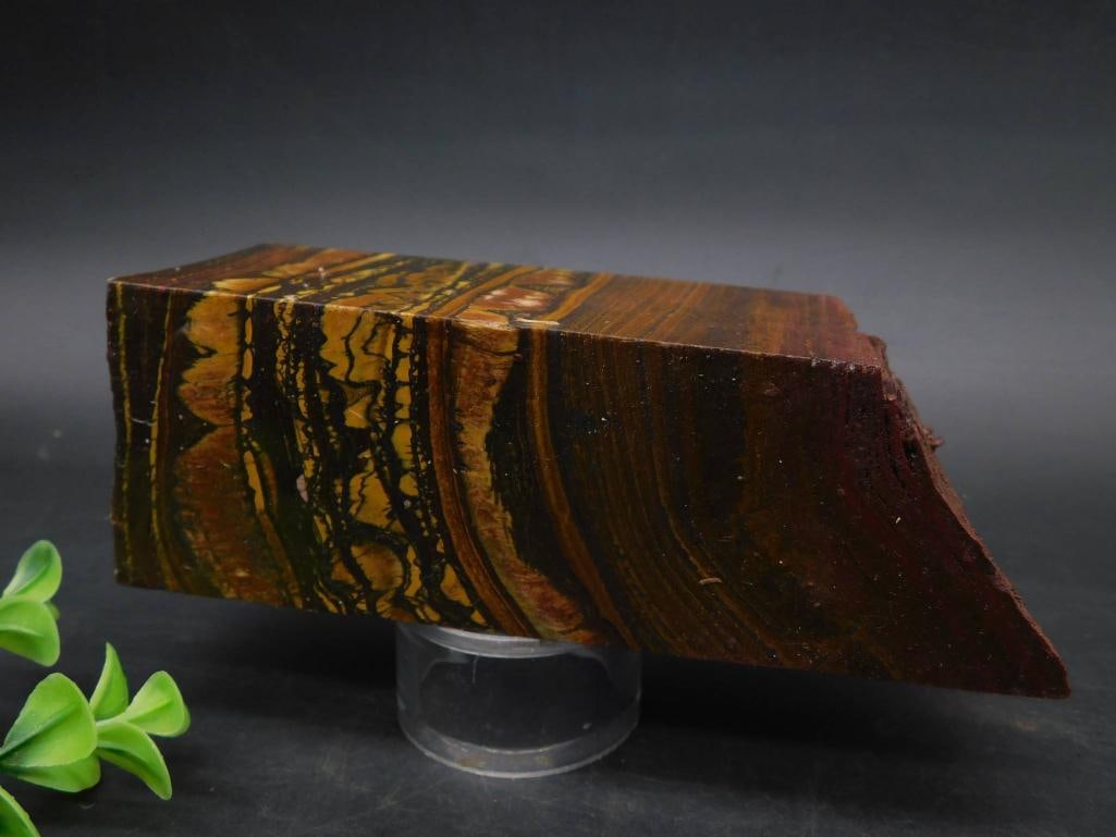 1 POUND 12 OUNCE TIGER IRON ROCK STONE LAPIDARY SPECIMEN: - Material: Tiger Iron, a combination of Tiger's Eye, Hematite, and Red Jasper. | - Coloration: Swirling patterns of golden yellow, deep brown, and black with reflective sections. | - Dimensions: