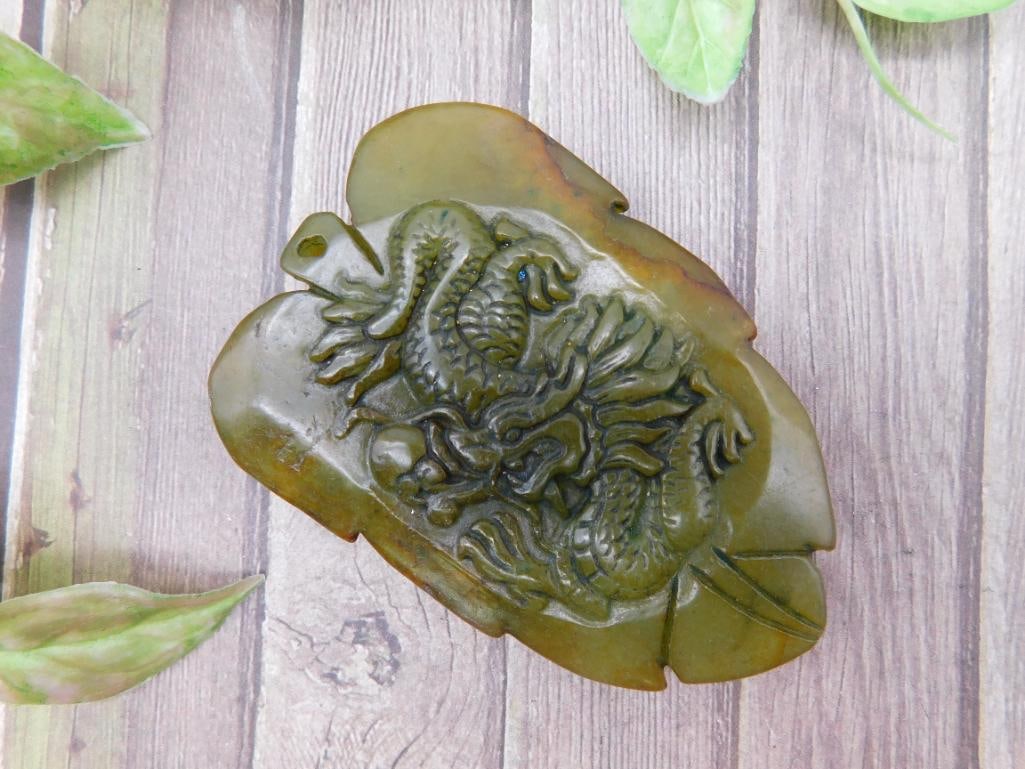 Green Jade Carving Featuring Mythical Dragon Design: Green Jade Carving Featuring Mythical Dragon Design