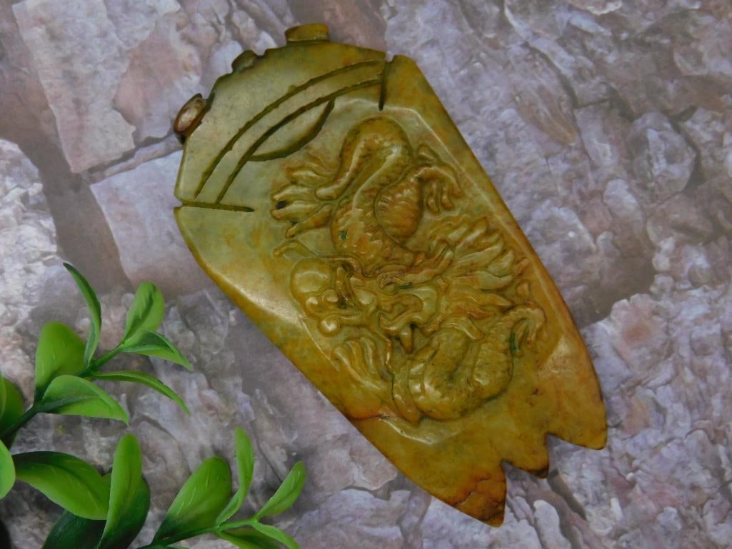 Carved Jade Piece Featuring Dragon Design: Carved Jade Piece Featuring Dragon Design