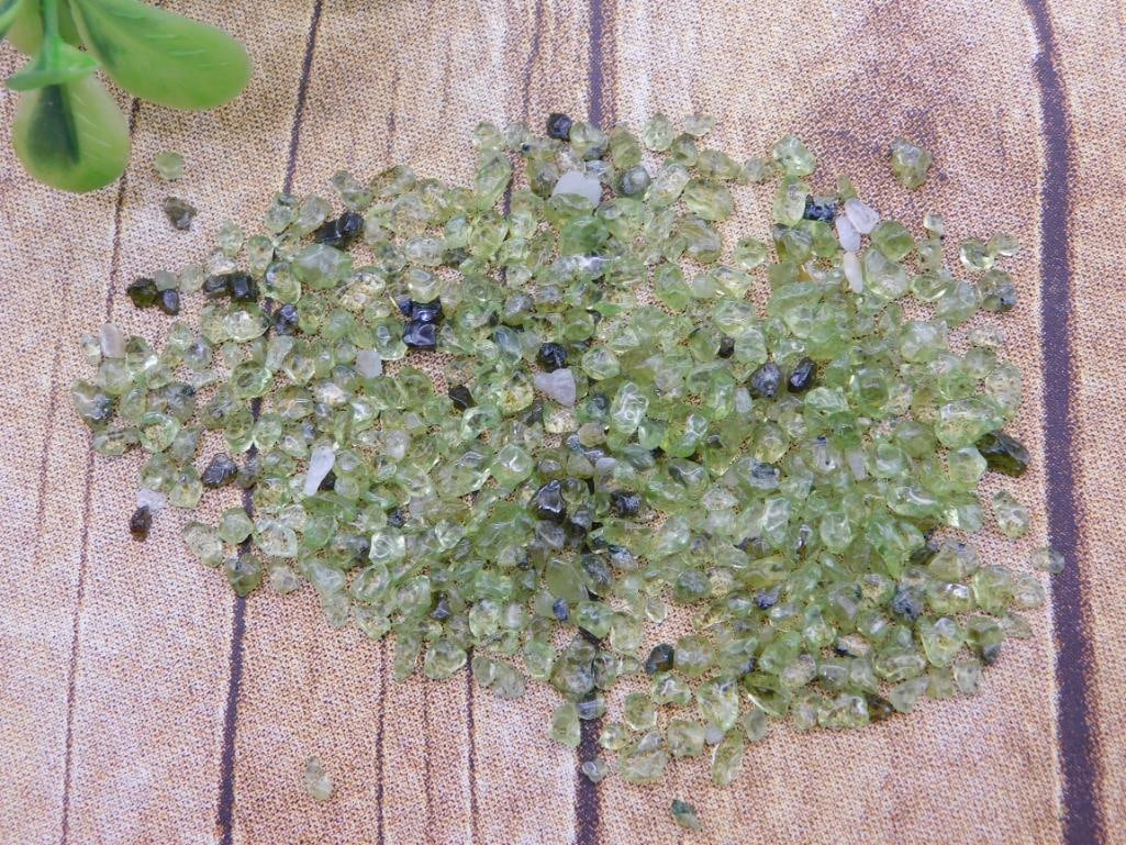 PERIDOT ROCK STONE LAPIDARY SPECIMEN - NATURAL GREEN GEMSTONE MINERAL FOR COLLECTORS: This natural peridot specimen offers the gemstone's vivid green color, appealing to mineral collectors and jewelry makers alike. A nice find for a gemstone collection or lapidary project. See photos f
