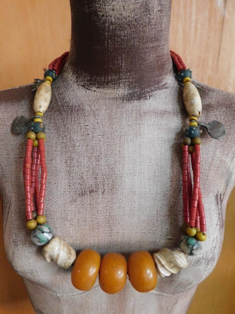 THICK AMBER BEADED AFRICAN TRADE BEAD NECKLACE: THICK AMBER BEADED AFRICAN TRADE BEAD NECKLACE — Part of our Discover Hidden Harbor, Crystals and Gems auction at HATMAN'S Auctions! Please see photos for measurements and condition. YES, we have in