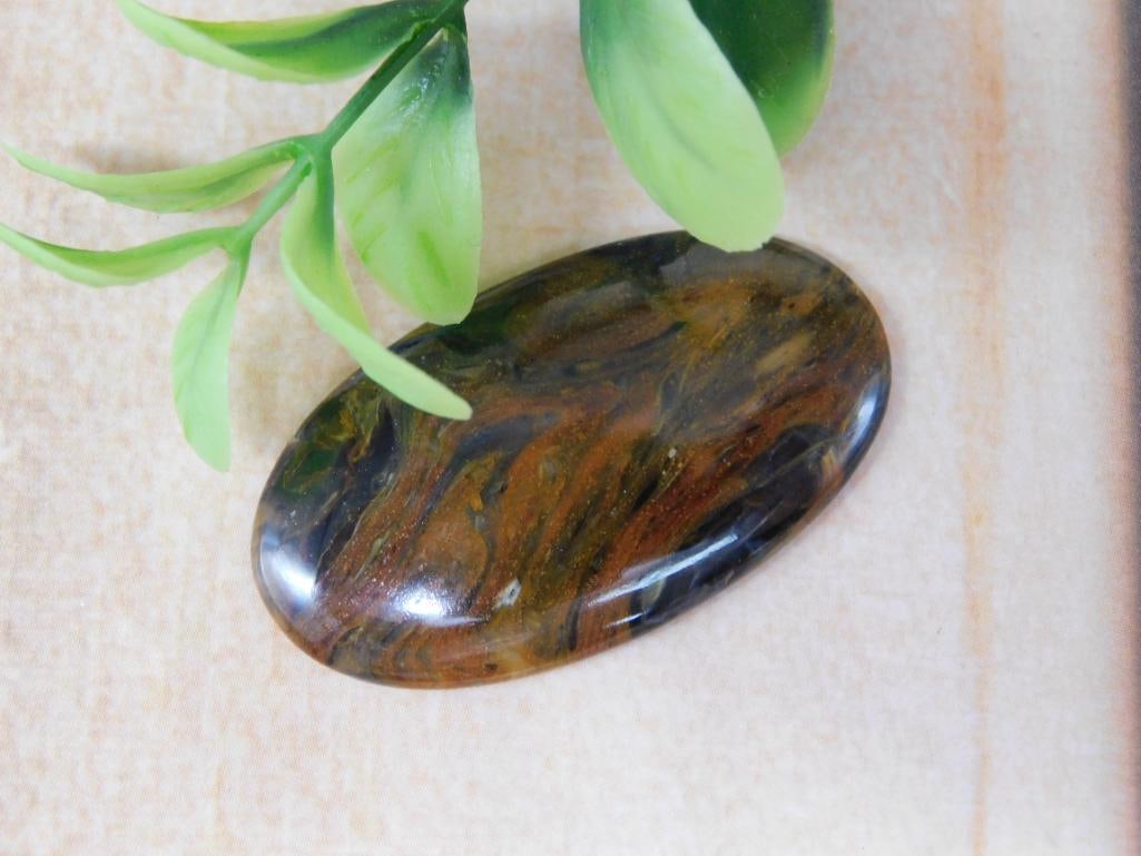 PIETERSITE CABOCHON ROCK STONE LAPIDARY SPECIMEN: PIETERSITE CABOCHON ROCK STONE LAPIDARY SPECIMEN - Part of our Discover Golden Attic, Crystals and Gems auction at HATMAN'S Auctions! Please see photos for measurements and condition. YES, we have in-