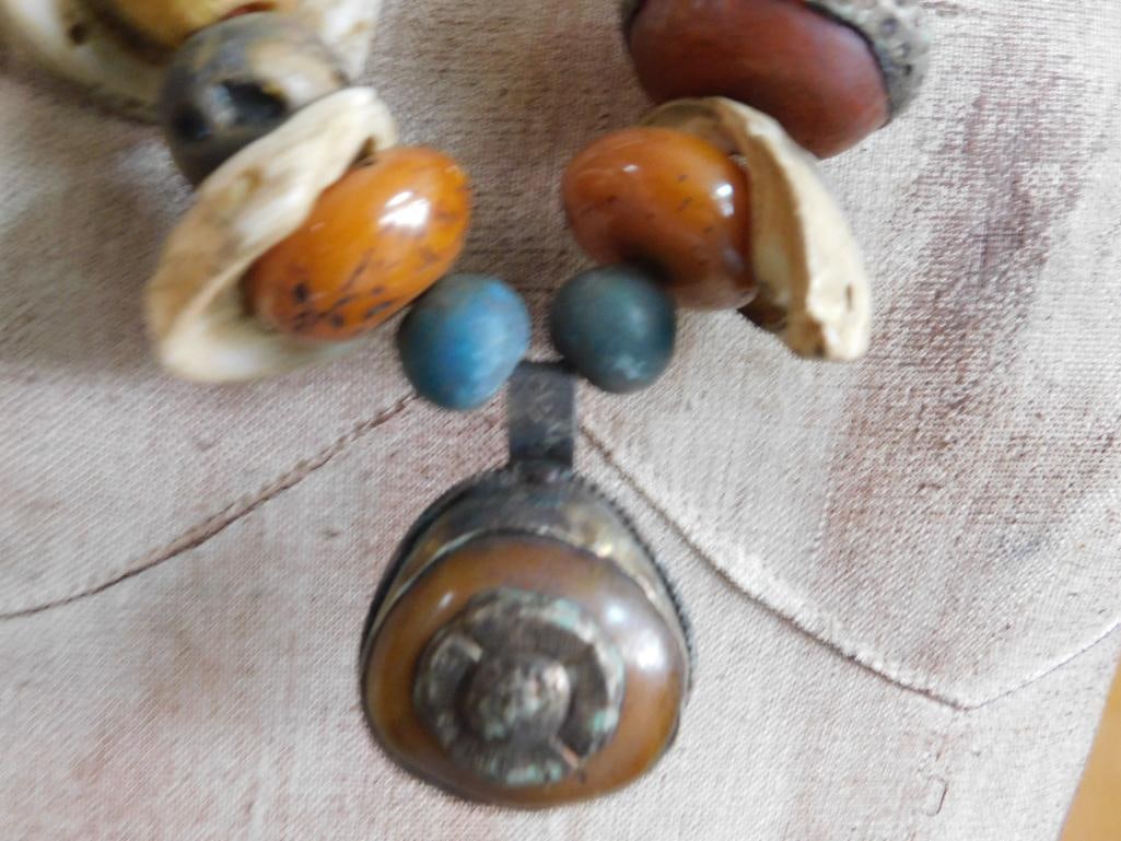 SHELL AND AMBER ACCENTED AFRICAN TRADE BEAD NECKLACE: SHELL AND AMBER ACCENTED AFRICAN TRADE BEAD NECKLACE - Part of our Discover Golden Attic, Crystals and Gems auction at HATMAN'S Auctions! Please see photos for measurements and condition. YES, we