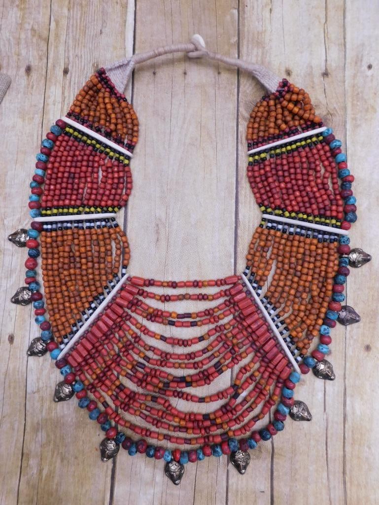 MULTICOLORED TRADITIONAL AFRICAN TRADE BEAD NECKLACE WITH METAL FACE ACCENT: MULTICOLORED TRADITIONAL AFRICAN TRADE BEAD NECKLACE WITH METAL FACE ACCENTS - Part of our Discover Golden Attic, Crystals and Gems auction at HATMAN'S Auctions! Please see photos for measurements