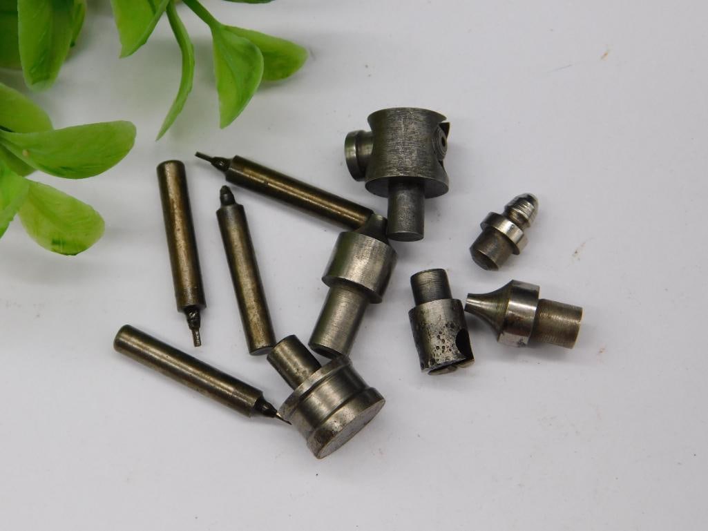10 Mixed Small Metal Tools and Accessories: Includes 10 small metal tools and accessories of varying shapes and sizes. | Comprised of robust metal material; specific type not stated. | Items appear to include drill bits, fittings, and other