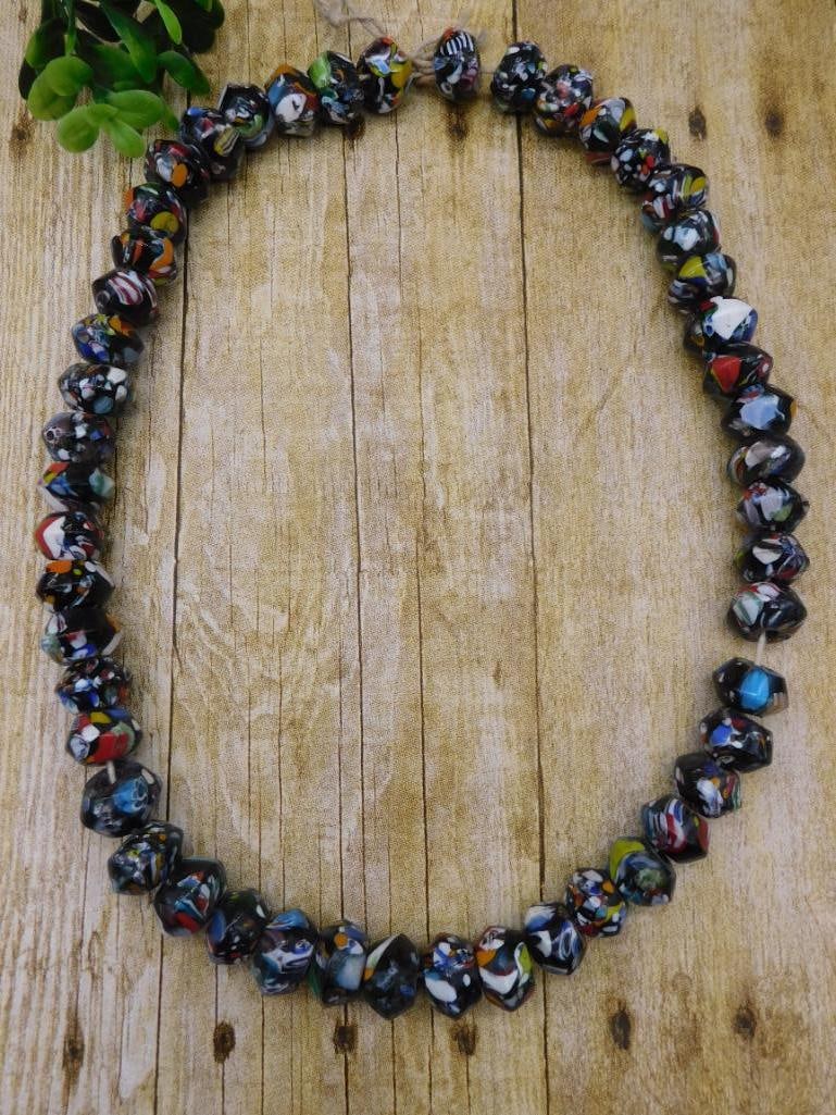 BLACK CANDY GLASS BEADS COLLECTOR JEWELRY MAKING VINTAGE STYLE BEAD LOT: These black candy glass beads offer collectors and jewelry makers a fun vintage-style option for beading projects and displays. See photos for exact count and condition.