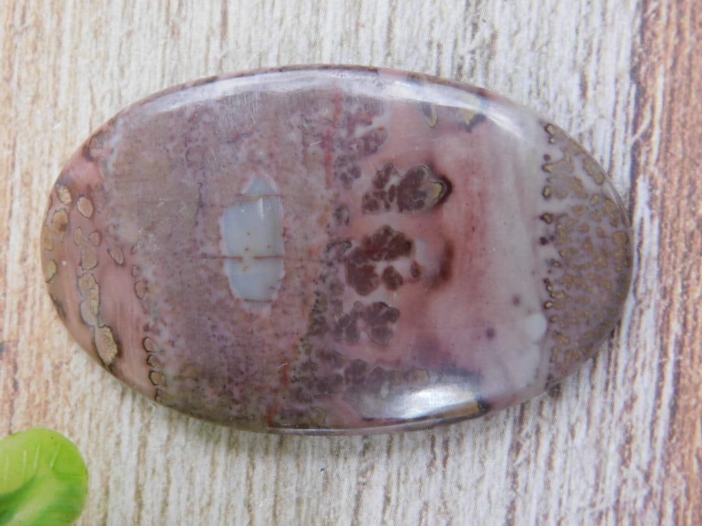 CABOCHON LAPIDARY ROCK STONE SPECIMEN - POLISHED COLLECTOR GEMSTONE PIECE: This finished cabochon showcases the natural stone's color and pattern in a smooth, polished form ideal for jewelry making or gemstone collecting. Lapidary hobbyists and jewelry crafters will find it 