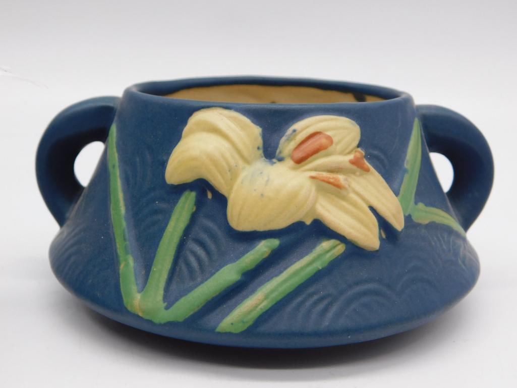 Roseville Pottery Iris Jardiniere - Blue Art Pottery Bowl: A blue-ground art pottery bowl with twin handles and a raised iris flower design, marked "Roseville U.S.A." on the base. The piece measures approximately 6 inches across. A nice addition for pottery