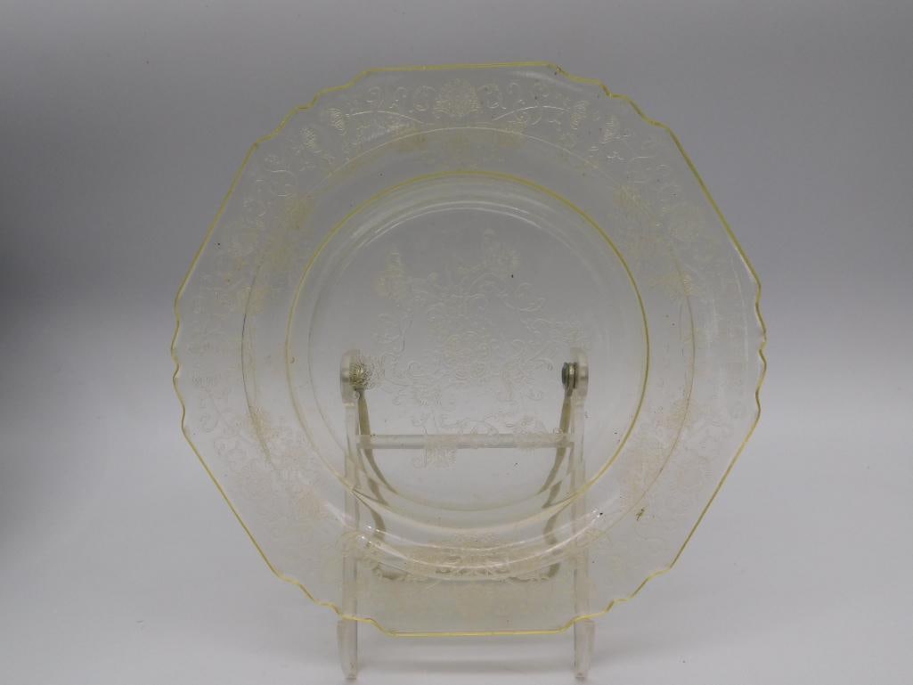 Depression Glass Etched Floral Plate: A pale yellow depression glass plate with a scalloped edge and an etched floral and scroll pattern radiating from the center. Measures approximately 8 inches in diameter. A lovely addition to any depr