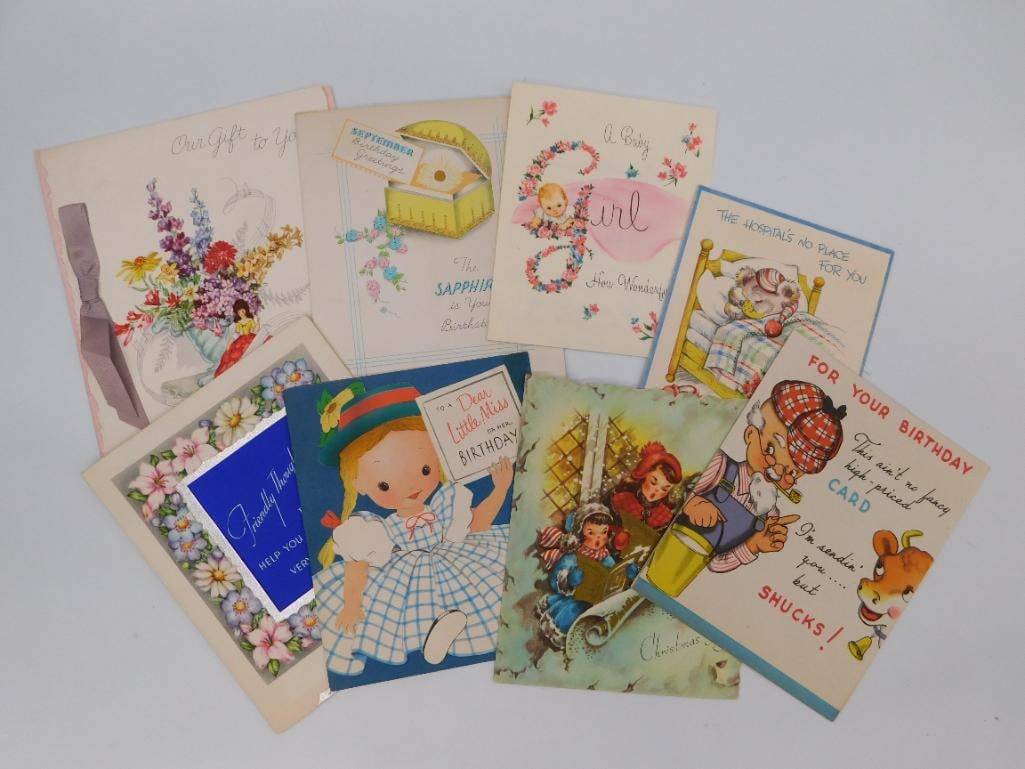 Antique Greeting Card Collection, Lot of 8: A collection of eight vintage greeting cards including birthday, baby, and holiday designs with colorful illustrations, die-cut details, and one card with a moveable red long-john design. A charming