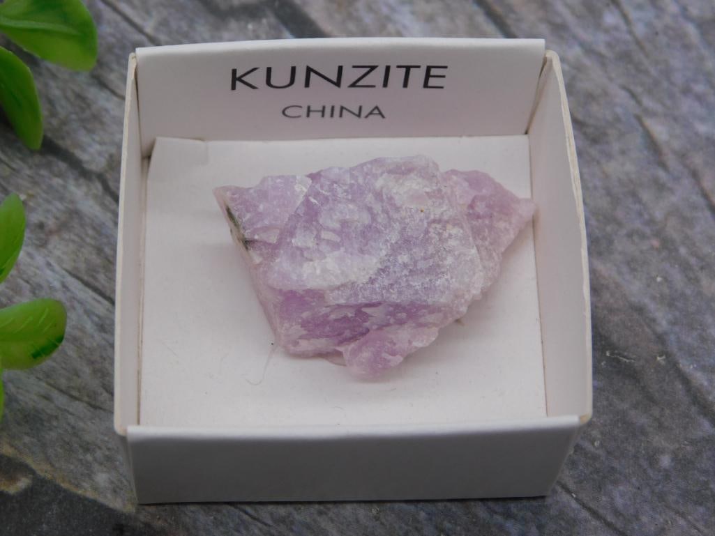 Rough Kunzite Mineral Specimen, 13 Grams: A rough lavender kunzite crystal specimen from China, shown in its original identification box, weighing 13 grams per the lot tag. A nice small specimen for mineral and crystal collectors.