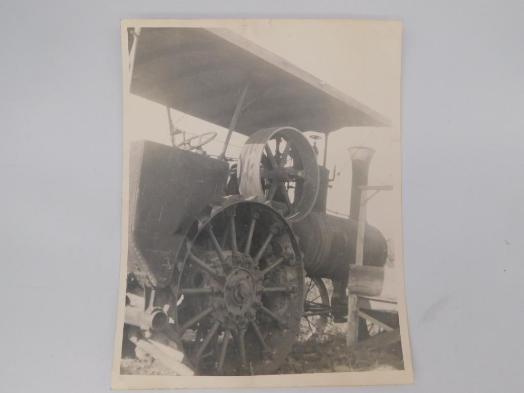 Antique Steam Tractor Photograph: A vintage black and white photograph showing a steam powered traction engine with large spoked wheels, photographed outdoors. Measures approximately 3.5 x 4.5 inches. A nice piece of rural Americana f