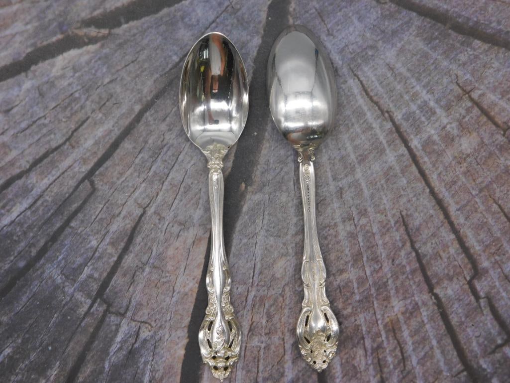 Sterling Silver — Pair of Gorham Sterling Tablespoons, Approx. 6 Inches: Two matching sterling silver tablespoons make up this lot, each marked "Gorham Sterling" along the handle with visible hallmark stamps. The spoons measure roughly 6 inches long and feature a scrolled,