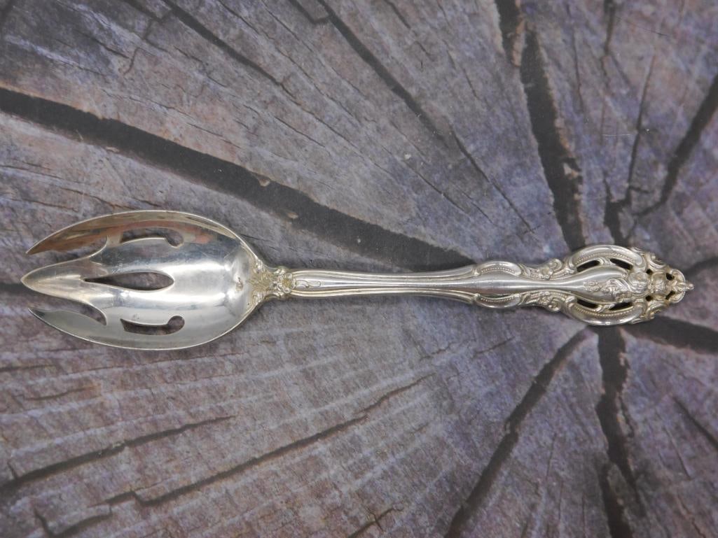 Sterling Silver Pierced Serving Spoon — Gorham Pattern, 8 Inches: A single sterling silver serving spoon with a pierced, slotted bowl, useful for serving vegetables or olives. Marked Gorham Sterling in the same ornate pattern as the rest of this collection, it