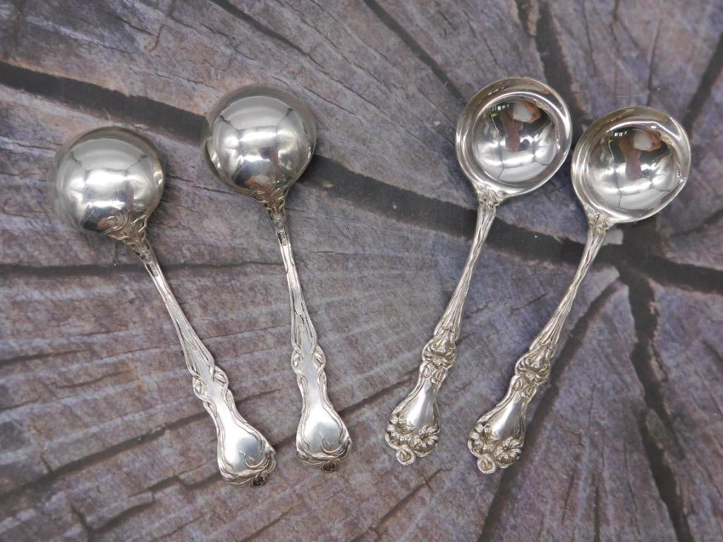 Sterling Silver Bouillon Spoons — Set of 4, Patent Marked, 5.5 Inches: A set of four sterling silver cream soup or bouillon spoons with round bowls, stamped Sterling and Patent alongside a small circular maker's mark. Each spoon measures approximately 5.5 inches long.