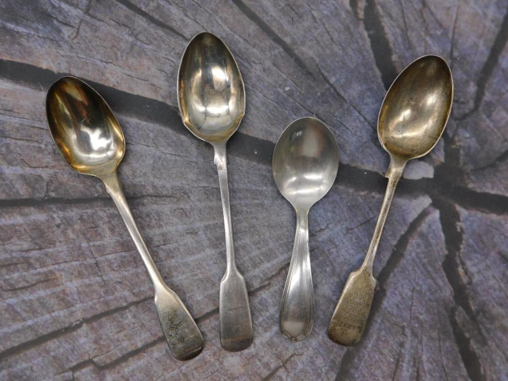 Sterling Silver Teaspoons — Group of 4 Assorted Antique Spoons: A mixed group of four antique sterling silver teaspoons with gold-washed bowls, in differing patterns and makers. One is marked Alvin Sterling, another carries English-style hallmark cartouches