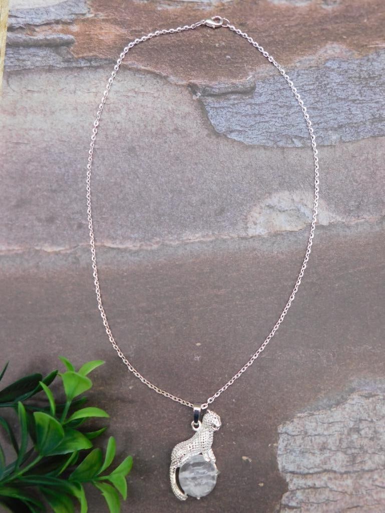 QUARTZ JAGUAR PENDANT ON CHAIN NECKLACE: Discover an extraordinary collection of natural wonders and estate treasures in Hatman's Auctions' Treasures of the Earth Online Auction! Browse turquoise, agate, jasper, petrified wood, quartz